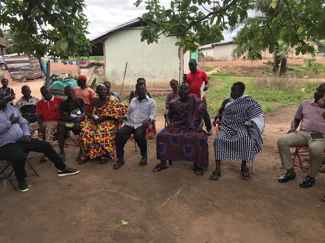 Traditional chiefs and community leaders in kente cloth during stakeholder consultation at Aframso